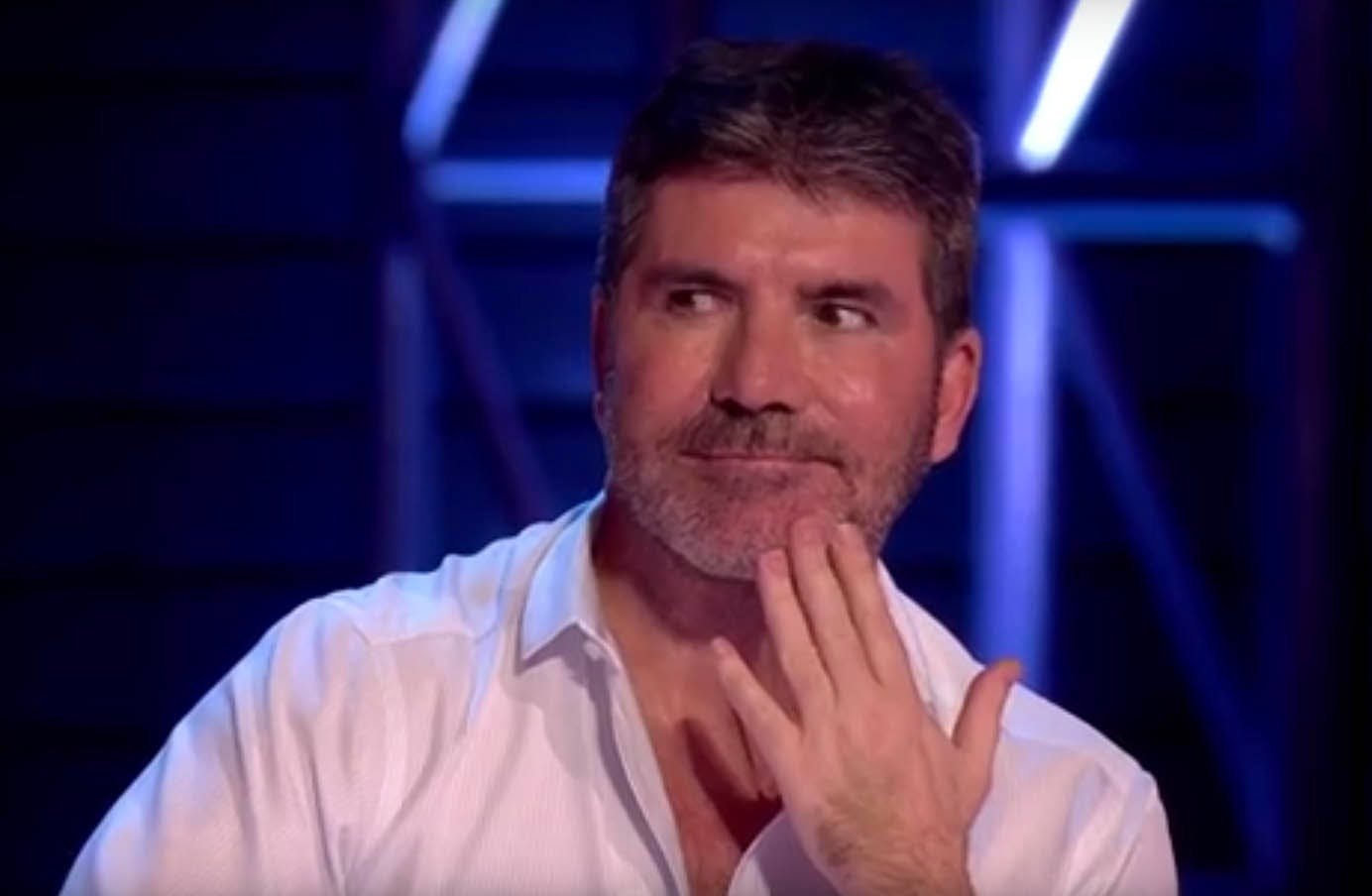 X Factor judge Simon Cowell is NOT happy about Russian model Irina